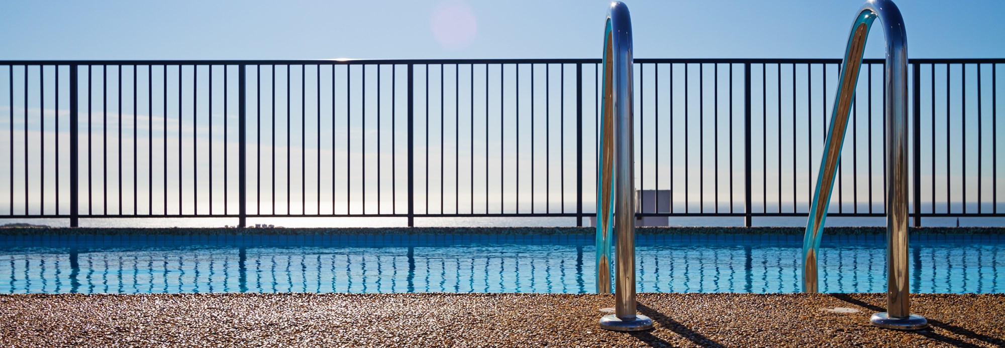 istock-swimming pool with fence